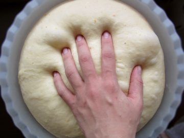 Squeezing The Dough To Remove Air